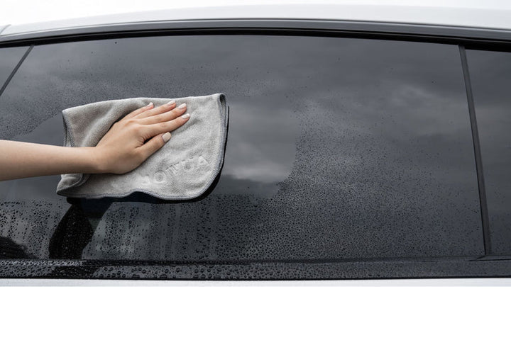 Microfiber cloth cleaning car window