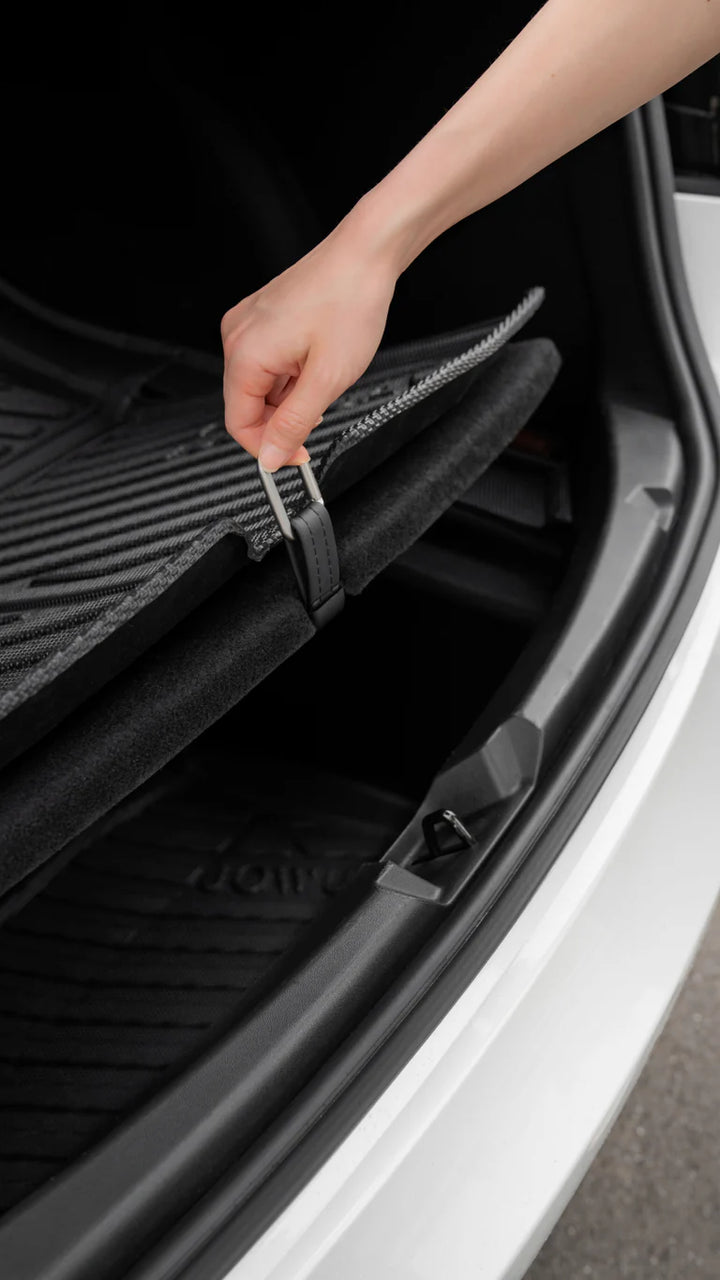 Pulling Model 3 trunk liner with snap hook