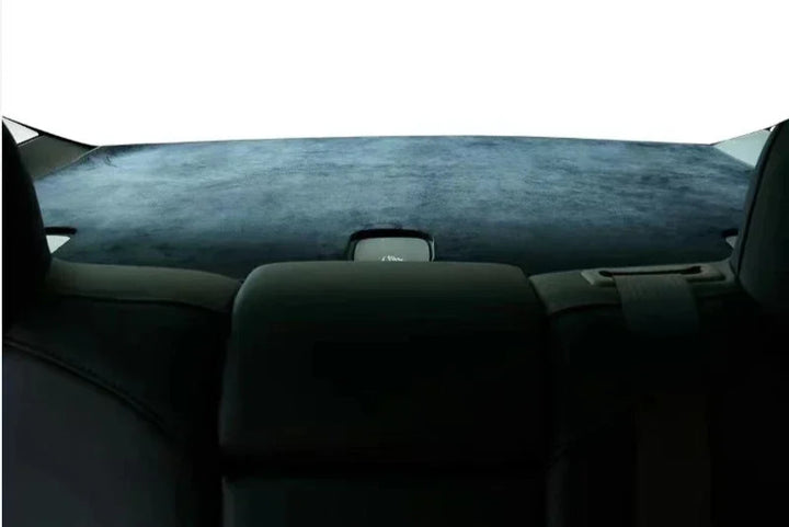 A black flocking trunk mat designed for the Tesla Model 3, placed inside the trunk of the car highlighting its fit and design.