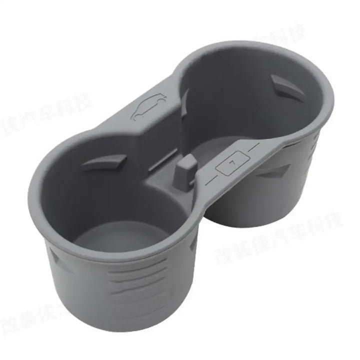 Silicone Non-Slip Cup Holder and Phone Limiter for Central Console for Tesla Model 3 Y 2021-2023 is available at Ludicrous EV.
