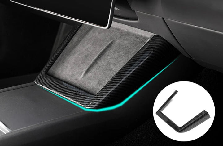 Protective cover for central control panel in a Tesla Model 3, featuring a carbon fiber looking texture with a U-shaped design for wireless charging access.