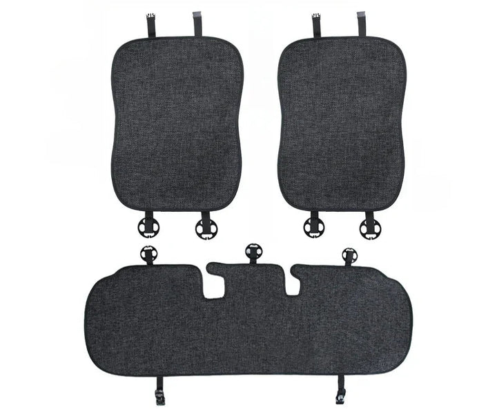 Flax seat pad covers installed on the front and rear seats of a Tesla Model Y, showcasing the product's design and fit.