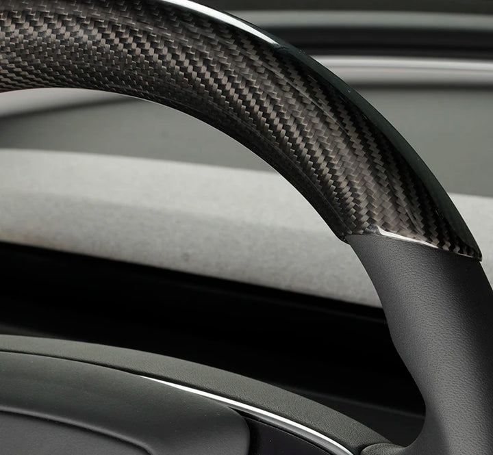 Real Carbon Fiber Steering Wheel Cover for Tesla Model 3+ Highland is available at Ludicrous EV.