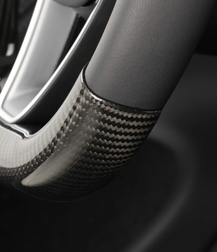 Real Carbon Fiber Steering Wheel Cover for Tesla Model 3+ Highland is available at Ludicrous EV.