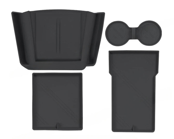 Set of silicone central control storage pads for Tesla Model 3, including a water cup mat, armrest box lower storage mat, and wireless charging pad with side pockets.