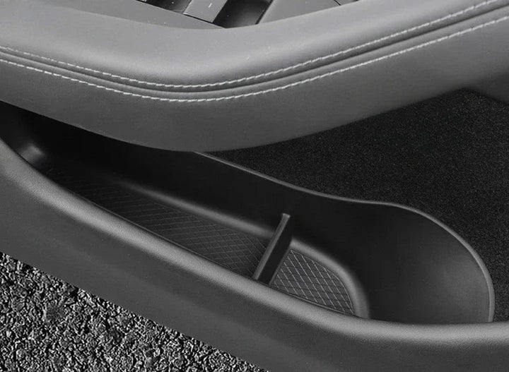 A black TPE door side storage box designed for Tesla Model 3, displayed next to the interior of the vehicle's door showing the product's placement and fit for the vehicle.