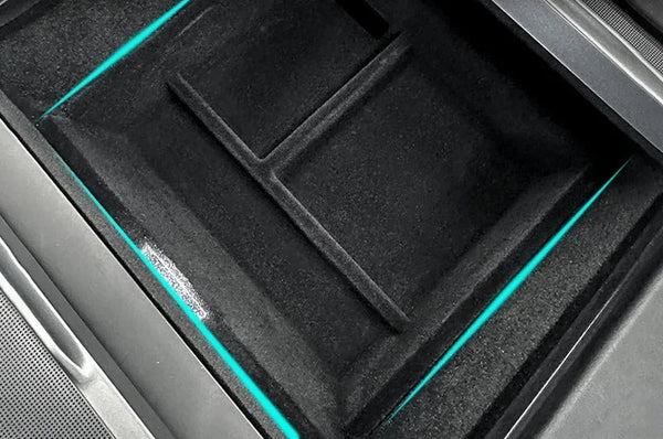 A black central control storage box designed for Tesla Model 3, featuring a flocked PVC interior and a turquoise trim.