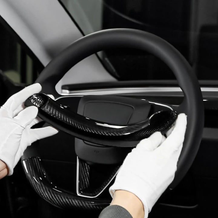 Real Carbon Fiber Steering Wheel Cover for Tesla Model 3+ Highland is available at Ludicrous EV.