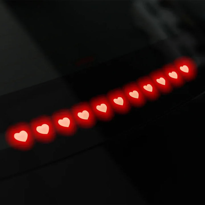 A collage of images showing brake light stickers for Tesla Model 3/3+ Highland. The stickers are displayed in red color with text and symbols, and are shown in various states of application including the packaging, the car trunk, and the vehicle itself.