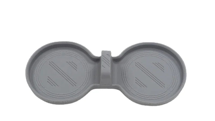 Set of silicone central control storage pads for Tesla Model 3, including a water cup mat, armrest box lower storage mat, and wireless charging pad with side pockets.